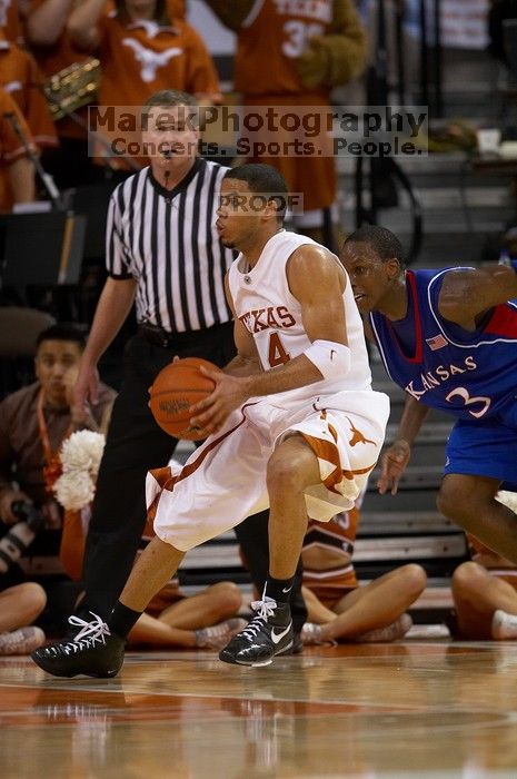 UT junior A.J. Abrams (#3, G) playing defense against a Kansas player.  The University of Texas (UT) Longhorns defeated the University of Kansas Jayhawks 72-69 in Austin, Texas on Monday, February 11, 2008.

Filename: SRM_20080211_2054303.jpg
Aperture: f/2.8
Shutter Speed: 1/640
Body: Canon EOS 20D
Lens: Canon EF 300mm f/2.8 L IS