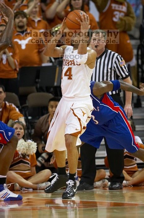 UT junior A.J. Abrams (#3, G) playing defense against a Kansas player.  The University of Texas (UT) Longhorns defeated the University of Kansas Jayhawks 72-69 in Austin, Texas on Monday, February 11, 2008.

Filename: SRM_20080211_2054324.jpg
Aperture: f/2.8
Shutter Speed: 1/640
Body: Canon EOS 20D
Lens: Canon EF 300mm f/2.8 L IS