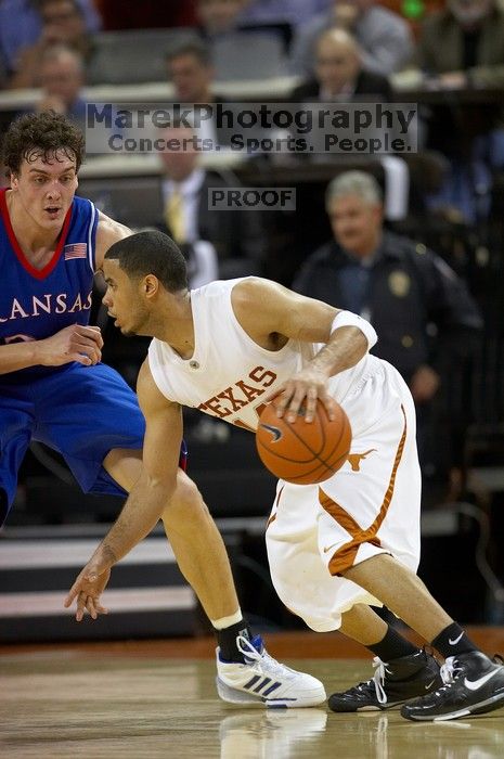 UT junior A.J. Abrams (#3, G) playing defense against a Kansas player.  The University of Texas (UT) Longhorns defeated the University of Kansas Jayhawks 72-69 in Austin, Texas on Monday, February 11, 2008.

Filename: SRM_20080211_2058586.jpg
Aperture: f/2.8
Shutter Speed: 1/640
Body: Canon EOS 20D
Lens: Canon EF 300mm f/2.8 L IS