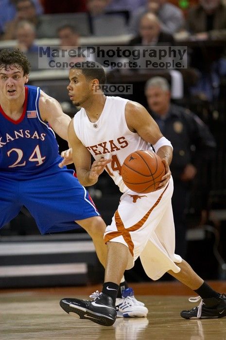 UT junior A.J. Abrams (#3, G) playing defense against a Kansas player.  The University of Texas (UT) Longhorns defeated the University of Kansas Jayhawks 72-69 in Austin, Texas on Monday, February 11, 2008.

Filename: SRM_20080211_2059007.jpg
Aperture: f/2.8
Shutter Speed: 1/640
Body: Canon EOS 20D
Lens: Canon EF 300mm f/2.8 L IS