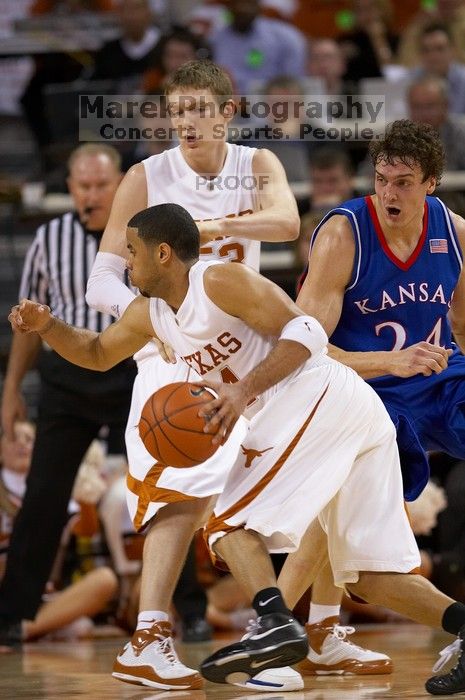 UT junior A.J. Abrams (#3, G) playing defense against a Kansas player.  The University of Texas (UT) Longhorns defeated the University of Kansas Jayhawks 72-69 in Austin, Texas on Monday, February 11, 2008.

Filename: SRM_20080211_2059081.jpg
Aperture: f/2.8
Shutter Speed: 1/640
Body: Canon EOS 20D
Lens: Canon EF 300mm f/2.8 L IS