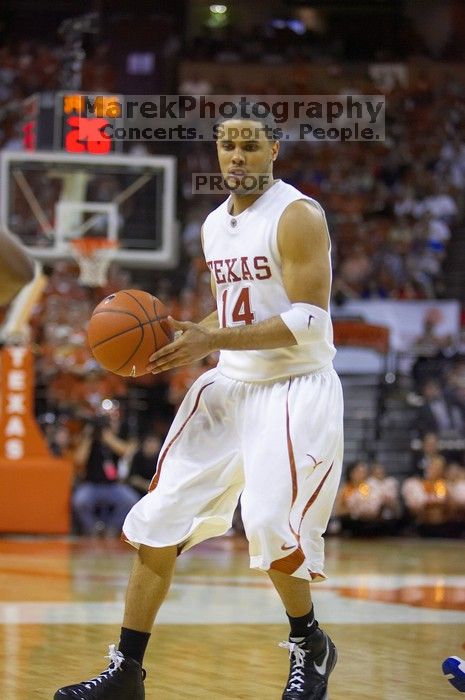 UT junior A.J. Abrams (#3, G) playing defense against a Kansas player.  The University of Texas (UT) Longhorns defeated the University of Kansas Jayhawks 72-69 in Austin, Texas on Monday, February 11, 2008.

Filename: SRM_20080211_2118040.jpg
Aperture: f/2.8
Shutter Speed: 1/640
Body: Canon EOS-1D Mark II
Lens: Canon EF 80-200mm f/2.8 L