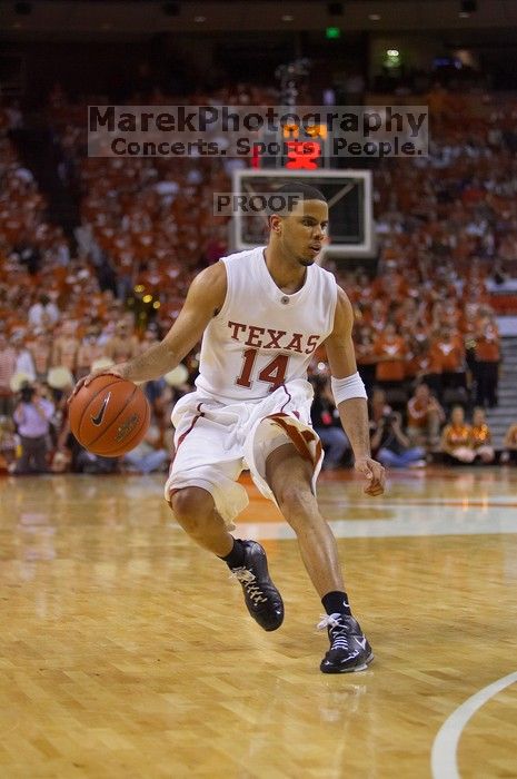 UT junior A.J. Abrams (#3, G) playing defense against a Kansas player.  The University of Texas (UT) Longhorns defeated the University of Kansas Jayhawks 72-69 in Austin, Texas on Monday, February 11, 2008.

Filename: SRM_20080211_2120446.jpg
Aperture: f/2.8
Shutter Speed: 1/640
Body: Canon EOS-1D Mark II
Lens: Canon EF 80-200mm f/2.8 L