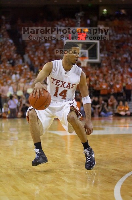 UT junior A.J. Abrams (#3, G) playing defense against a Kansas player.  The University of Texas (UT) Longhorns defeated the University of Kansas Jayhawks 72-69 in Austin, Texas on Monday, February 11, 2008.

Filename: SRM_20080211_2120447.jpg
Aperture: f/2.8
Shutter Speed: 1/640
Body: Canon EOS-1D Mark II
Lens: Canon EF 80-200mm f/2.8 L