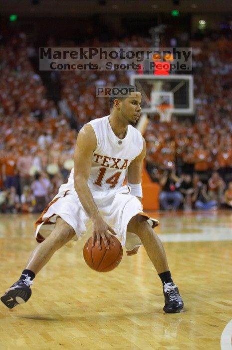 UT junior A.J. Abrams (#3, G) playing defense against a Kansas player.  The University of Texas (UT) Longhorns defeated the University of Kansas Jayhawks 72-69 in Austin, Texas on Monday, February 11, 2008.

Filename: SRM_20080211_2120468.jpg
Aperture: f/2.8
Shutter Speed: 1/640
Body: Canon EOS-1D Mark II
Lens: Canon EF 80-200mm f/2.8 L