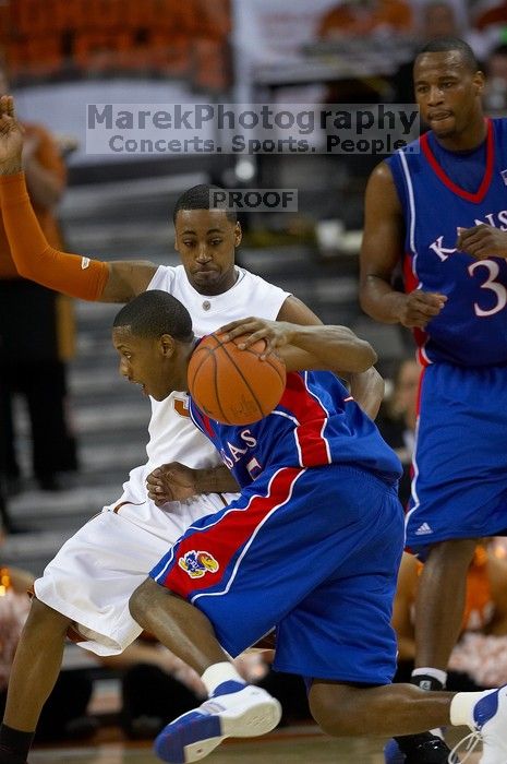 UT junior A.J. Abrams (#3, G) defends KU senior Rodrick Stewart (#5, Guard).  The University of Texas (UT) Longhorns defeated the University of Kansas Jayhawks 72-69 in Austin, Texas on Monday, February 11, 2008.

Filename: SRM_20080211_2122303.jpg
Aperture: f/2.8
Shutter Speed: 1/800
Body: Canon EOS 20D
Lens: Canon EF 300mm f/2.8 L IS