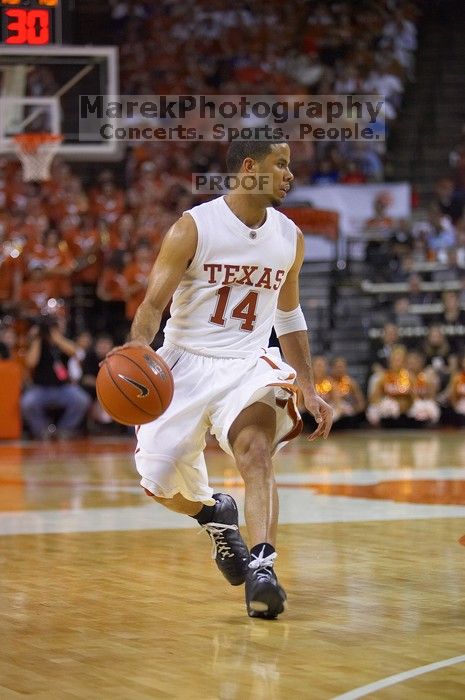 UT junior A.J. Abrams (#3, G) playing defense against a Kansas player.  The University of Texas (UT) Longhorns defeated the University of Kansas Jayhawks 72-69 in Austin, Texas on Monday, February 11, 2008.

Filename: SRM_20080211_2123547.jpg
Aperture: f/2.8
Shutter Speed: 1/640
Body: Canon EOS-1D Mark II
Lens: Canon EF 80-200mm f/2.8 L