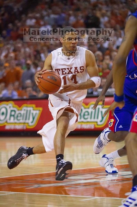 UT junior A.J. Abrams (#3, G) playing defense against a Kansas player.  The University of Texas (UT) Longhorns defeated the University of Kansas Jayhawks 72-69 in Austin, Texas on Monday, February 11, 2008.

Filename: SRM_20080211_2133304.jpg
Aperture: f/2.8
Shutter Speed: 1/640
Body: Canon EOS-1D Mark II
Lens: Canon EF 80-200mm f/2.8 L