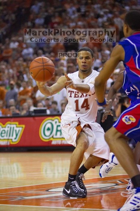 UT junior A.J. Abrams (#3, G) playing defense against a Kansas player.  The University of Texas (UT) Longhorns defeated the University of Kansas Jayhawks 72-69 in Austin, Texas on Monday, February 11, 2008.

Filename: SRM_20080211_2133325.jpg
Aperture: f/2.8
Shutter Speed: 1/640
Body: Canon EOS-1D Mark II
Lens: Canon EF 80-200mm f/2.8 L