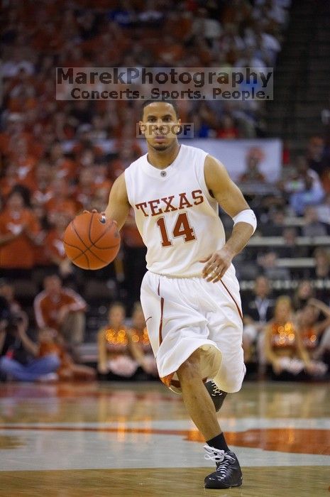 UT junior A.J. Abrams (#3, G) playing defense against a Kansas player.  The University of Texas (UT) Longhorns defeated the University of Kansas Jayhawks 72-69 in Austin, Texas on Monday, February 11, 2008.

Filename: SRM_20080211_2134081.jpg
Aperture: f/2.8
Shutter Speed: 1/640
Body: Canon EOS-1D Mark II
Lens: Canon EF 80-200mm f/2.8 L