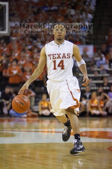 UT junior A.J. Abrams (#3, G) playing defense against a Kansas player.  The University of Texas (UT) Longhorns defeated the University of Kansas Jayhawks 72-69 in Austin, Texas on Monday, February 11, 2008.

Filename: SRM_20080211_2134103.jpg
Aperture: f/2.8
Shutter Speed: 1/640
Body: Canon EOS-1D Mark II
Lens: Canon EF 80-200mm f/2.8 L