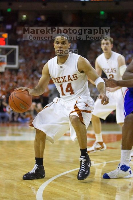 UT junior A.J. Abrams (#3, G) playing defense against a Kansas player.  The University of Texas (UT) Longhorns defeated the University of Kansas Jayhawks 72-69 in Austin, Texas on Monday, February 11, 2008.

Filename: SRM_20080211_2135088.jpg
Aperture: f/2.8
Shutter Speed: 1/640
Body: Canon EOS-1D Mark II
Lens: Canon EF 80-200mm f/2.8 L