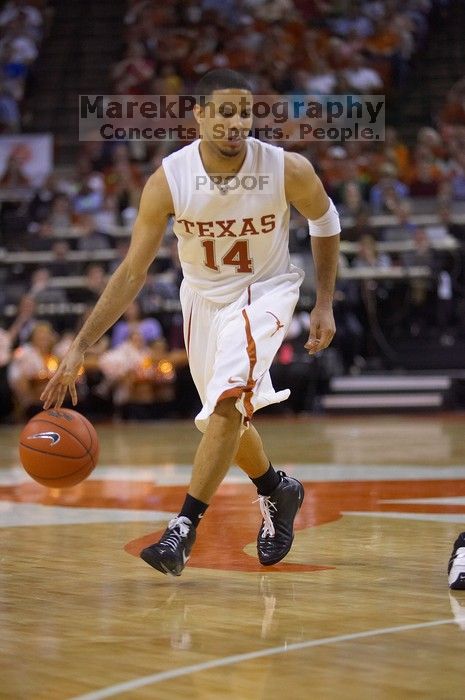 UT junior A.J. Abrams (#3, G) playing defense against a Kansas player.  The University of Texas (UT) Longhorns defeated the University of Kansas Jayhawks 72-69 in Austin, Texas on Monday, February 11, 2008.

Filename: SRM_20080211_2142208.jpg
Aperture: f/2.8
Shutter Speed: 1/640
Body: Canon EOS-1D Mark II
Lens: Canon EF 80-200mm f/2.8 L