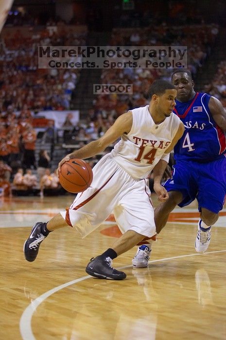 UT sophomore D.J. Augustin (#14, G) makes a drive past KU sophomore Sherron Collins (#4, Guard).  The University of Texas (UT) Longhorns defeated the University of Kansas Jayhawks 72-69 in Austin, Texas on Monday, February 11, 2008.

Filename: SRM_20080211_2142220.jpg
Aperture: f/2.8
Shutter Speed: 1/640
Body: Canon EOS-1D Mark II
Lens: Canon EF 80-200mm f/2.8 L