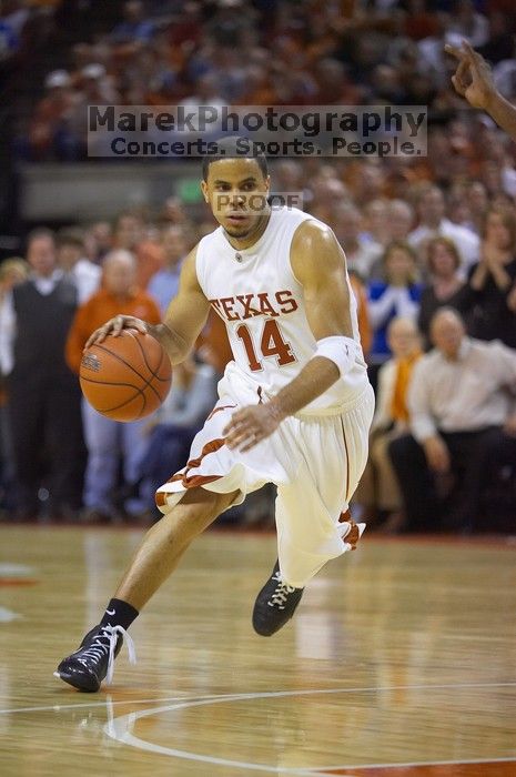 UT junior A.J. Abrams (#3, G) playing defense against a Kansas player.  The University of Texas (UT) Longhorns defeated the University of Kansas Jayhawks 72-69 in Austin, Texas on Monday, February 11, 2008.

Filename: SRM_20080211_2145249.jpg
Aperture: f/2.8
Shutter Speed: 1/640
Body: Canon EOS-1D Mark II
Lens: Canon EF 80-200mm f/2.8 L