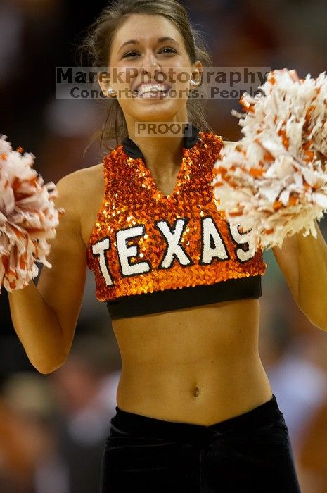 The University of Texas (UT) Longhorns defeated the University of Kansas Jayhawks 72-69 in Austin, Texas on Monday, February 11, 2008.

Filename: SRM_20080211_2148386.jpg
Aperture: f/2.8
Shutter Speed: 1/640
Body: Canon EOS 20D
Lens: Canon EF 300mm f/2.8 L IS