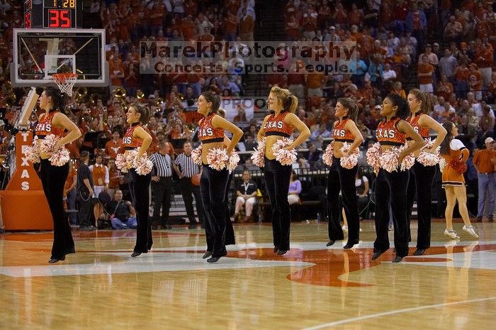 Texas Pom.  The University of Texas (UT) Longhorns defeated the University of Kansas Jayhawks 72-69 in Austin, Texas on Monday, February 11, 2008.

Filename: SRM_20080211_2148528.jpg
Aperture: f/2.8
Shutter Speed: 1/640
Body: Canon EOS-1D Mark II
Lens: Canon EF 80-200mm f/2.8 L