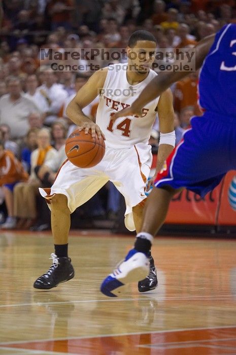 UT junior A.J. Abrams (#3, G) playing defense against a Kansas player.  The University of Texas (UT) Longhorns defeated the University of Kansas Jayhawks 72-69 in Austin, Texas on Monday, February 11, 2008.

Filename: SRM_20080211_2153160.jpg
Aperture: f/2.8
Shutter Speed: 1/640
Body: Canon EOS-1D Mark II
Lens: Canon EF 80-200mm f/2.8 L