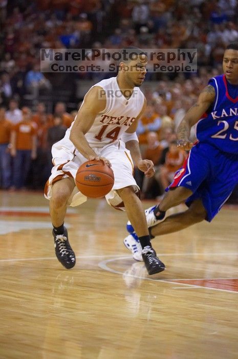 UT junior A.J. Abrams (#3, G) playing defense against a Kansas player.  The University of Texas (UT) Longhorns defeated the University of Kansas Jayhawks 72-69 in Austin, Texas on Monday, February 11, 2008.

Filename: SRM_20080211_2153203.jpg
Aperture: f/2.8
Shutter Speed: 1/640
Body: Canon EOS-1D Mark II
Lens: Canon EF 80-200mm f/2.8 L