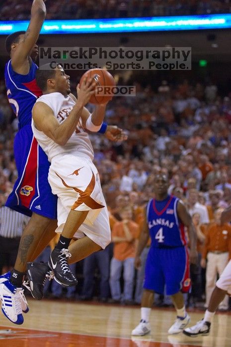 UT sophomore D.J. Augustin (#14, G) takes a shot with KU senior Rodrick Stewart (#5, Guard) on his back.  The University of Texas (UT) Longhorns defeated the University of Kansas Jayhawks 72-69 in Austin, Texas on Monday, February 11, 2008.

Filename: SRM_20080211_2153289.jpg
Aperture: f/2.8
Shutter Speed: 1/640
Body: Canon EOS-1D Mark II
Lens: Canon EF 80-200mm f/2.8 L