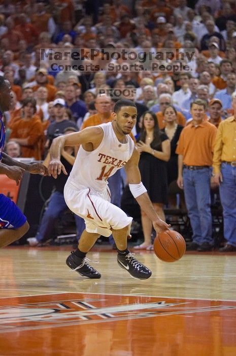 UT junior A.J. Abrams (#3, G) playing defense against a Kansas player.  The University of Texas (UT) Longhorns defeated the University of Kansas Jayhawks 72-69 in Austin, Texas on Monday, February 11, 2008.

Filename: SRM_20080211_2155325.jpg
Aperture: f/2.8
Shutter Speed: 1/640
Body: Canon EOS-1D Mark II
Lens: Canon EF 80-200mm f/2.8 L