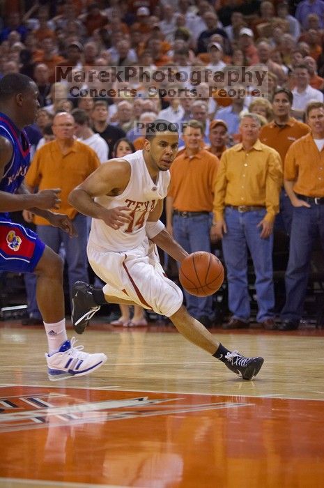 UT junior A.J. Abrams (#3, G) playing defense against a Kansas player.  The University of Texas (UT) Longhorns defeated the University of Kansas Jayhawks 72-69 in Austin, Texas on Monday, February 11, 2008.

Filename: SRM_20080211_2155346.jpg
Aperture: f/2.8
Shutter Speed: 1/640
Body: Canon EOS-1D Mark II
Lens: Canon EF 80-200mm f/2.8 L