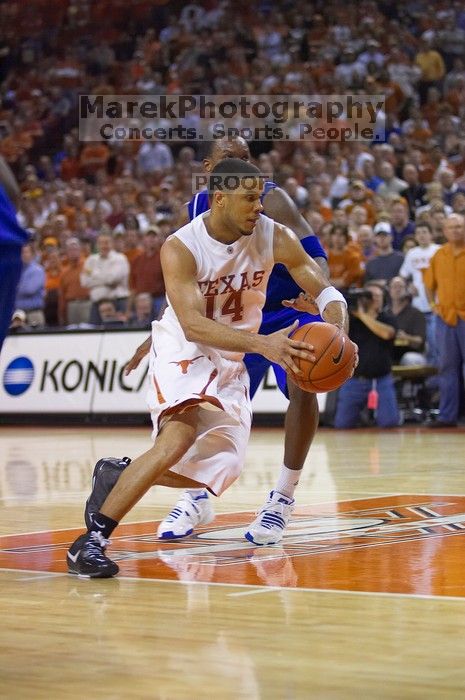 UT junior A.J. Abrams (#3, G) playing defense against a Kansas player.  The University of Texas (UT) Longhorns defeated the University of Kansas Jayhawks 72-69 in Austin, Texas on Monday, February 11, 2008.

Filename: SRM_20080211_2158204.jpg
Aperture: f/2.8
Shutter Speed: 1/640
Body: Canon EOS-1D Mark II
Lens: Canon EF 80-200mm f/2.8 L