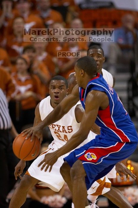 UT sophomore Justin Mason (#24, G) playing defense.  The University of Texas (UT) Longhorns defeated the University of Kansas Jayhawks 72-69 in Austin, Texas on Monday, February 11, 2008.

Filename: SRM_20080211_2159063.jpg
Aperture: f/2.8
Shutter Speed: 1/640
Body: Canon EOS 20D
Lens: Canon EF 300mm f/2.8 L IS