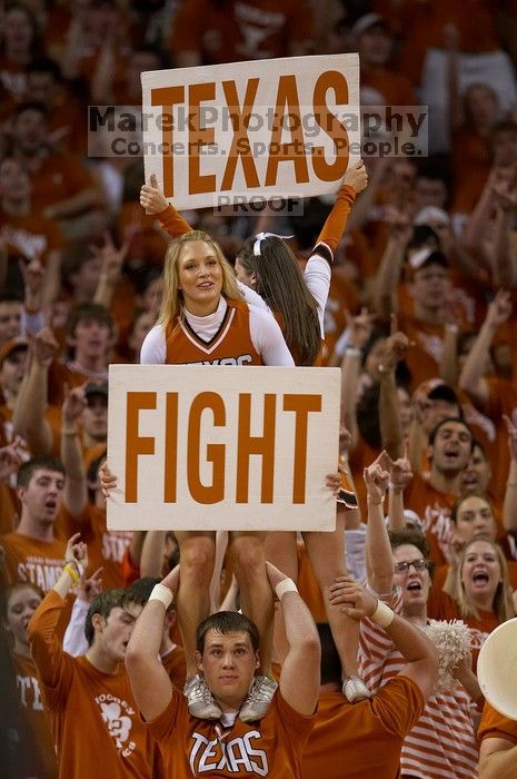 Cheerleaders.  The University of Texas (UT) Longhorns defeated the University of Kansas Jayhawks 72-69 in Austin, Texas on Monday, February 11, 2008.

Filename: SRM_20080211_2204127.jpg
Aperture: f/2.8
Shutter Speed: 1/640
Body: Canon EOS 20D
Lens: Canon EF 300mm f/2.8 L IS