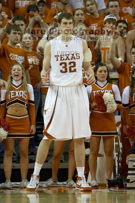 UT junior Connor Atchley (#32, F/C) is significantly taller than the cheerleaders.  The University of Texas (UT) Longhorns defeated the University of Kansas Jayhawks 72-69 in Austin, Texas on Monday, February 11, 2008.

Filename: SRM_20080211_2214026.jpg
Aperture: f/2.8
Shutter Speed: 1/640
Body: Canon EOS 20D
Lens: Canon EF 300mm f/2.8 L IS