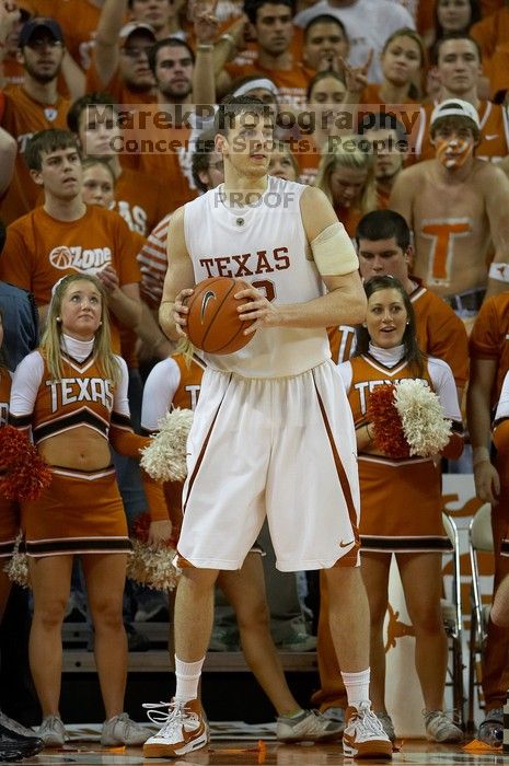 UT junior Connor Atchley (#32, F/C) is significantly taller than the cheerleaders.  The University of Texas (UT) Longhorns defeated the University of Kansas Jayhawks 72-69 in Austin, Texas on Monday, February 11, 2008.

Filename: SRM_20080211_2214100.jpg
Aperture: f/2.8
Shutter Speed: 1/640
Body: Canon EOS 20D
Lens: Canon EF 300mm f/2.8 L IS