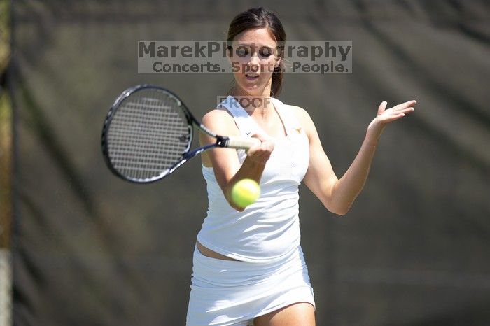 Fourth singles UT freshman Maggie Mello lost to CSUS junior Karina Jarlkaganova 6-7 (2), 4-6.  The University of Texas defeated Sacramento State on Saturday, March 22, 2008.

Filename: SRM_20080322_1253565.jpg
Aperture: f/2.8
Shutter Speed: 1/2500
Body: Canon EOS-1D Mark II
Lens: Canon EF 300mm f/2.8 L IS