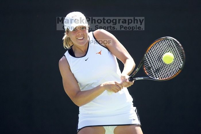 Second singles UT senior Courtney Zauft defeated CSUS junior Anastassia Lyssenko 4-6, 6-3, 10-6.  The University of Texas defeated Sacramento State on Saturday, March 22, 2008.

Filename: SRM_20080322_1306207.jpg
Aperture: f/2.8
Shutter Speed: 1/2000
Body: Canon EOS-1D Mark II
Lens: Canon EF 300mm f/2.8 L IS