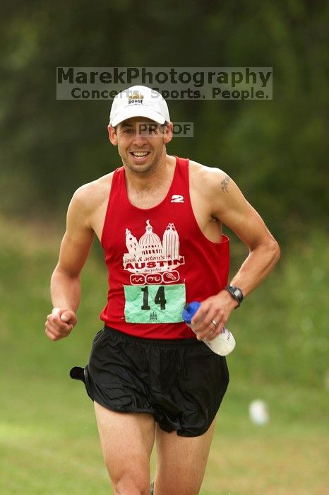 Paul Terranova  placed second overall in The Saint 30K trail race, sponsored by Rogue, at the Saint Stephen's Episcopal School on Sunday morning, June 29, 2008.

Filename: SRM_20080629_0909189.jpg
Aperture: f/4.0
Shutter Speed: 1/320
Body: Canon EOS 20D
Lens: Canon EF 300mm f/2.8 L IS