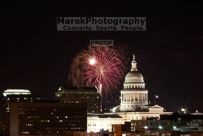 Austin Independence Day fireworks with the Capitol building, as viewed from atop the Manor Garage at The University of Texas at Austin.  The fireworks were launched from Auditorium Shores, downtown Austin, Friday, July 4, 2008.

Filename: SRM_20080704_2140240.jpg
Aperture: f/11.0
Shutter Speed: 6/1
Body: Canon EOS 20D
Lens: Canon EF 80-200mm f/2.8 L