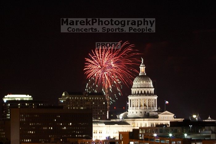 Austin Independence Day fireworks with the Capitol building, as viewed from atop the Manor Garage at The University of Texas at Austin.  The fireworks were launched from Auditorium Shores, downtown Austin, Friday, July 4, 2008.

Filename: SRM_20080704_2140341.jpg
Aperture: f/11.0
Shutter Speed: 6/1
Body: Canon EOS 20D
Lens: Canon EF 80-200mm f/2.8 L