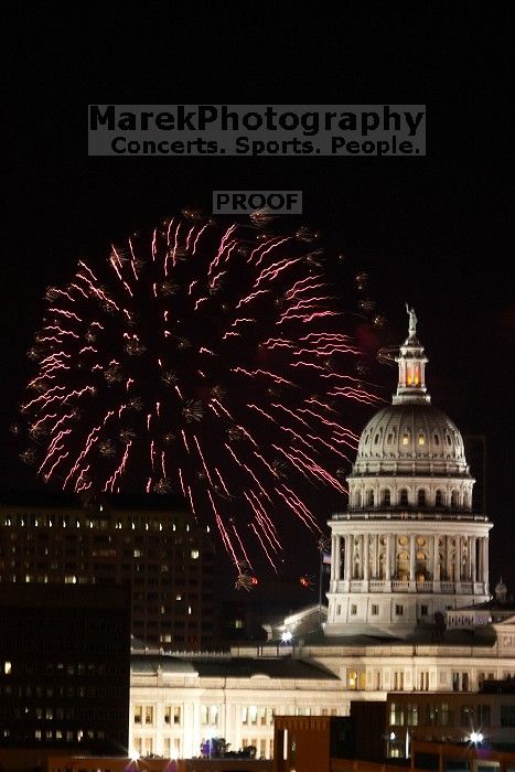 Austin Independence Day fireworks with the Capitol building, as viewed from atop the Manor Garage at The University of Texas at Austin.  The fireworks were launched from Auditorium Shores, downtown Austin, Friday, July 4, 2008.

Filename: SRM_20080704_2144282.jpg
Aperture: f/11.0
Shutter Speed: 2/1
Body: Canon EOS 20D
Lens: Canon EF 80-200mm f/2.8 L