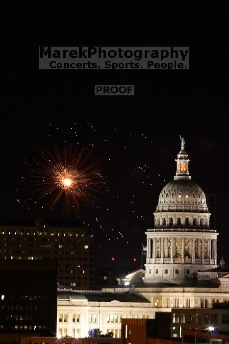 Austin Independence Day fireworks with the Capitol building, as viewed from atop the Manor Garage at The University of Texas at Austin.  The fireworks were launched from Auditorium Shores, downtown Austin, Friday, July 4, 2008.

Filename: SRM_20080704_2144323.jpg
Aperture: f/11.0
Shutter Speed: 2/1
Body: Canon EOS 20D
Lens: Canon EF 80-200mm f/2.8 L