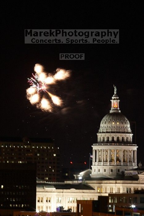 Austin Independence Day fireworks with the Capitol building, as viewed from atop the Manor Garage at The University of Texas at Austin.  The fireworks were launched from Auditorium Shores, downtown Austin, Friday, July 4, 2008.

Filename: SRM_20080704_2144404.jpg
Aperture: f/11.0
Shutter Speed: 2/1
Body: Canon EOS 20D
Lens: Canon EF 80-200mm f/2.8 L