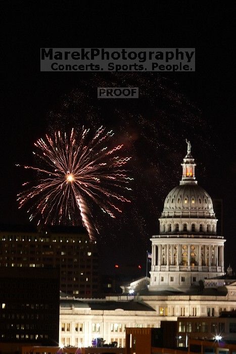 Austin Independence Day fireworks with the Capitol building, as viewed from atop the Manor Garage at The University of Texas at Austin.  The fireworks were launched from Auditorium Shores, downtown Austin, Friday, July 4, 2008.

Filename: SRM_20080704_2144465.jpg
Aperture: f/11.0
Shutter Speed: 2/1
Body: Canon EOS 20D
Lens: Canon EF 80-200mm f/2.8 L