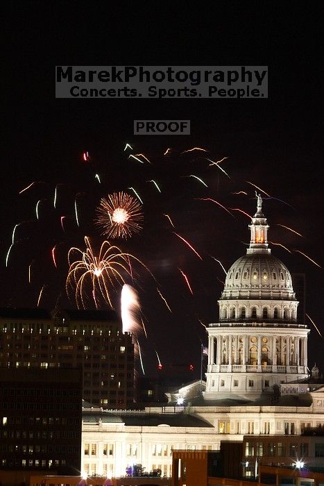 Austin Independence Day fireworks with the Capitol building, as viewed from atop the Manor Garage at The University of Texas at Austin.  The fireworks were launched from Auditorium Shores, downtown Austin, Friday, July 4, 2008.

Filename: SRM_20080704_2145127.jpg
Aperture: f/11.0
Shutter Speed: 5/1
Body: Canon EOS 20D
Lens: Canon EF 80-200mm f/2.8 L