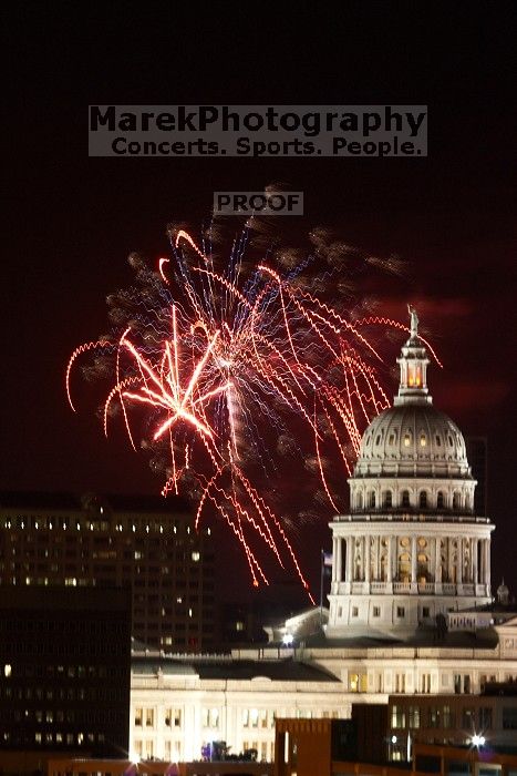 Austin Independence Day fireworks with the Capitol building, as viewed from atop the Manor Garage at The University of Texas at Austin.  The fireworks were launched from Auditorium Shores, downtown Austin, Friday, July 4, 2008.

Filename: SRM_20080704_2146000.jpg
Aperture: f/11.0
Shutter Speed: 5/1
Body: Canon EOS 20D
Lens: Canon EF 80-200mm f/2.8 L