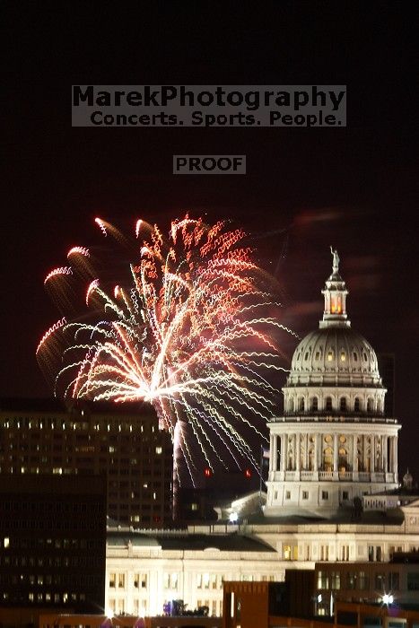 Austin Independence Day fireworks with the Capitol building, as viewed from atop the Manor Garage at The University of Texas at Austin.  The fireworks were launched from Auditorium Shores, downtown Austin, Friday, July 4, 2008.

Filename: SRM_20080704_2147005.jpg
Aperture: f/11.0
Shutter Speed: 5/1
Body: Canon EOS 20D
Lens: Canon EF 80-200mm f/2.8 L