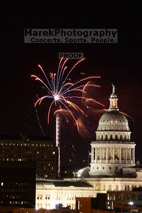 Austin Independence Day fireworks with the Capitol building, as viewed from atop the Manor Garage at The University of Texas at Austin.  The fireworks were launched from Auditorium Shores, downtown Austin, Friday, July 4, 2008.

Filename: SRM_20080704_2147126.jpg
Aperture: f/11.0
Shutter Speed: 5/1
Body: Canon EOS 20D
Lens: Canon EF 80-200mm f/2.8 L