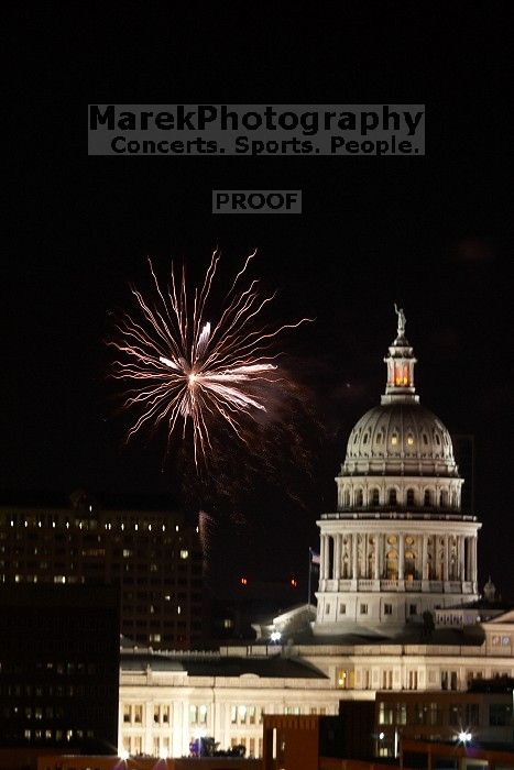 Austin Independence Day fireworks with the Capitol building, as viewed from atop the Manor Garage at The University of Texas at Austin.  The fireworks were launched from Auditorium Shores, downtown Austin, Friday, July 4, 2008.

Filename: SRM_20080704_2149187.jpg
Aperture: f/11.0
Shutter Speed: 2/1
Body: Canon EOS 20D
Lens: Canon EF 80-200mm f/2.8 L