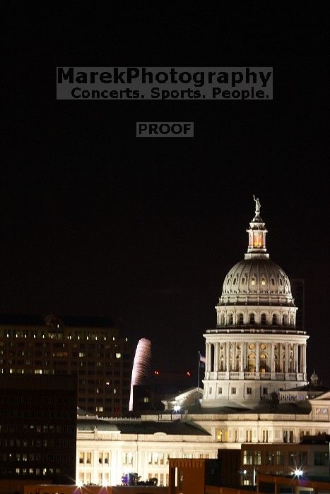 Austin Independence Day fireworks with the Capitol building, as viewed from atop the Manor Garage at The University of Texas at Austin.  The fireworks were launched from Auditorium Shores, downtown Austin, Friday, July 4, 2008.

Filename: SRM_20080704_2150101.jpg
Aperture: f/11.0
Shutter Speed: 5/1
Body: Canon EOS 20D
Lens: Canon EF 80-200mm f/2.8 L