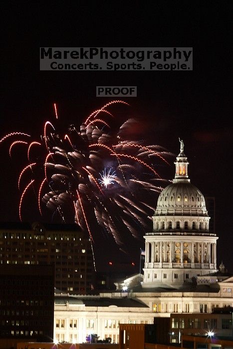 Austin Independence Day fireworks with the Capitol building, as viewed from atop the Manor Garage at The University of Texas at Austin.  The fireworks were launched from Auditorium Shores, downtown Austin, Friday, July 4, 2008.

Filename: SRM_20080704_2151126.jpg
Aperture: f/11.0
Shutter Speed: 5/1
Body: Canon EOS 20D
Lens: Canon EF 80-200mm f/2.8 L