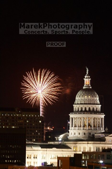 Austin Independence Day fireworks with the Capitol building, as viewed from atop the Manor Garage at The University of Texas at Austin.  The fireworks were launched from Auditorium Shores, downtown Austin, Friday, July 4, 2008.

Filename: SRM_20080704_2151388.jpg
Aperture: f/11.0
Shutter Speed: 5/1
Body: Canon EOS 20D
Lens: Canon EF 80-200mm f/2.8 L