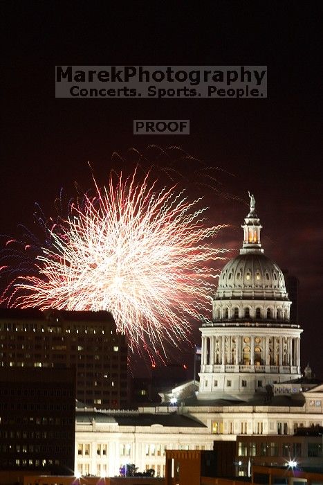 Austin Independence Day fireworks with the Capitol building, as viewed from atop the Manor Garage at The University of Texas at Austin.  The fireworks were launched from Auditorium Shores, downtown Austin, Friday, July 4, 2008.

Filename: SRM_20080704_2153265.jpg
Aperture: f/11.0
Shutter Speed: 5/1
Body: Canon EOS 20D
Lens: Canon EF 80-200mm f/2.8 L