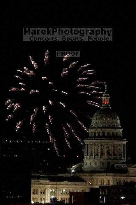 Austin Independence Day fireworks with the Capitol building, as viewed from atop the Manor Garage at The University of Texas at Austin.  The fireworks were launched from Auditorium Shores, downtown Austin, Friday, July 4, 2008.

Filename: SRM_20080704_2154001.jpg
Aperture: f/11.0
Shutter Speed: 1/1
Body: Canon EOS 20D
Lens: Canon EF 80-200mm f/2.8 L